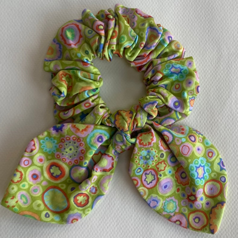 Floral patterned scrunchie on a light gray background