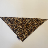 Leopard print fabric triangle on a white background