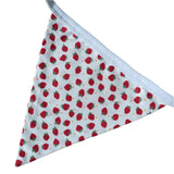 Red and white strawberry patterned bunting.