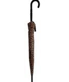 Leopard print umbrella with black handle against a white wall
